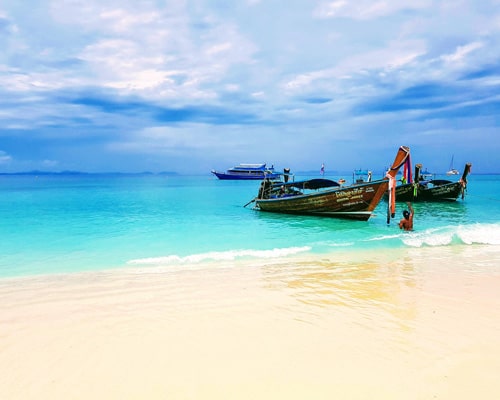 Image of a car next to a scenic lake